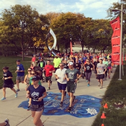 A crowd of runners at a local 5K event in downtown Lansing.